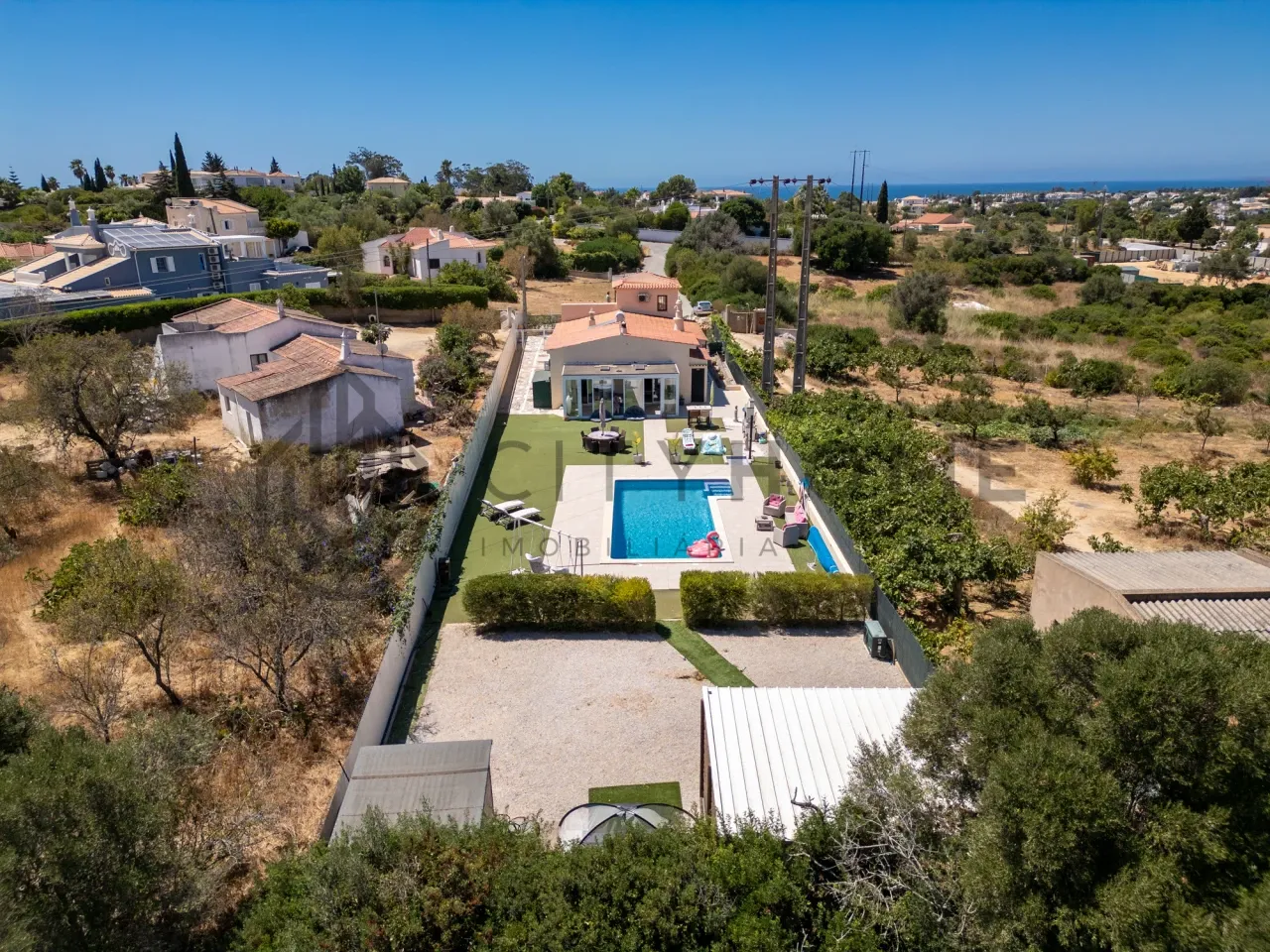 Contemporary 3-Bedroom House with Expansive Pool and Garden in Lagoa Portugal - Image 1