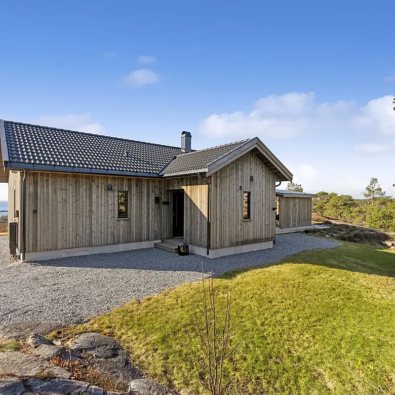 Modern 3-Bedroom Cabin in Grimstad with Sea Views and Expansive Terrace