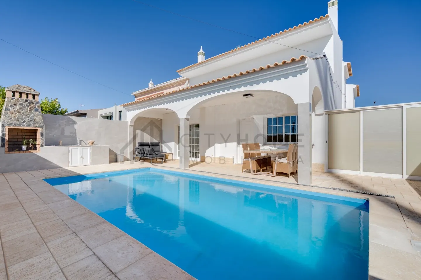 Modern 3-Bedroom Villa with Pool and Terrace in Vibrant Lagoa, Portugal - Image 1
