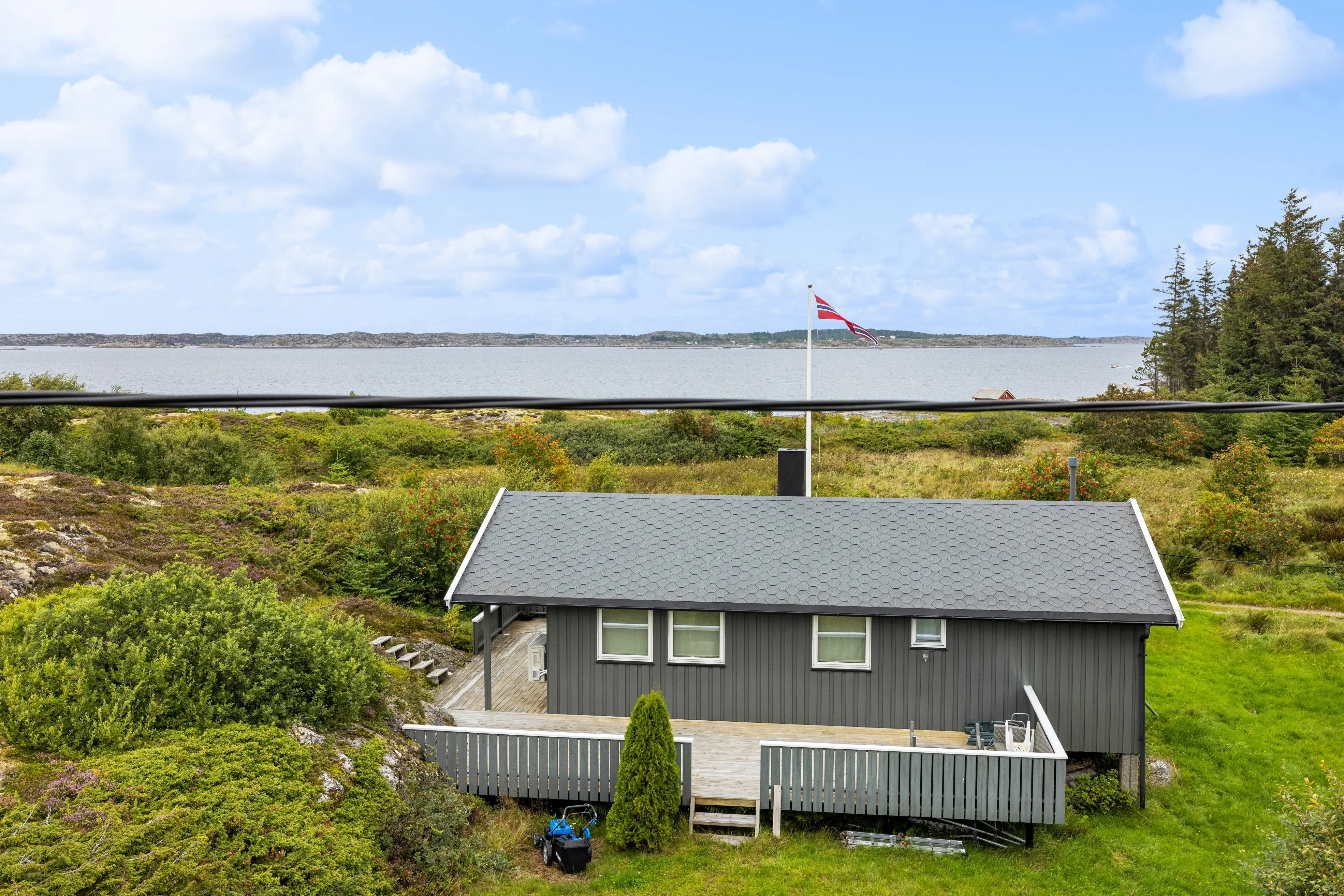 Coastal Retreat: 2-Bedroom House with Expansive Terrace in Kvenvær, Norway - Image 1
